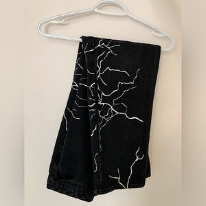 Retro style wide leg black denim Jeans with lightening graphics down the thighs